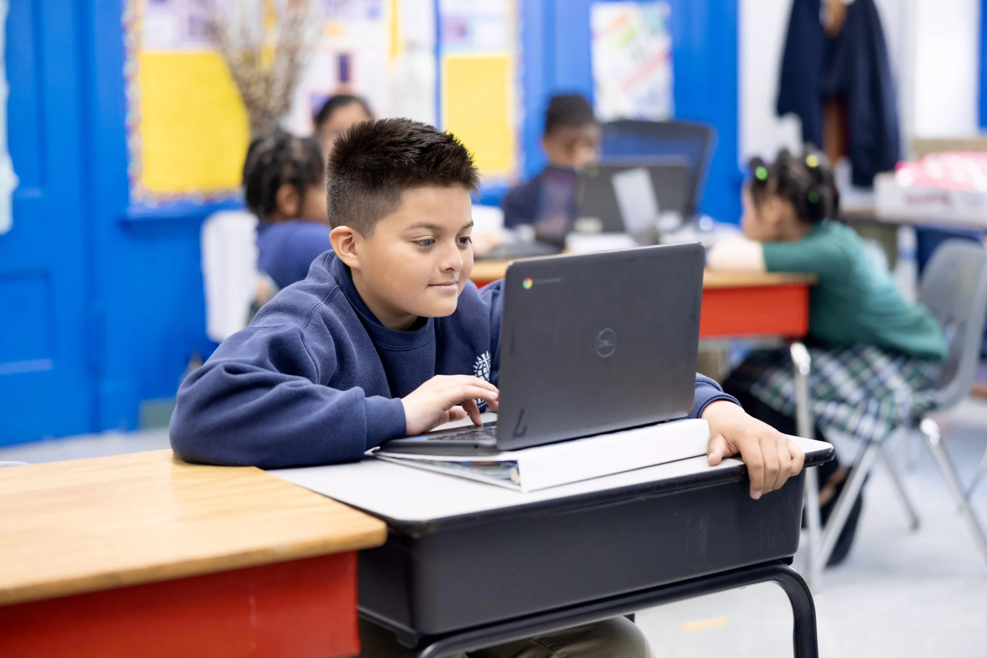 student working on a laptop