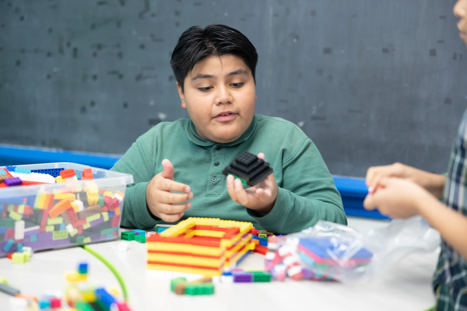 students building with legos