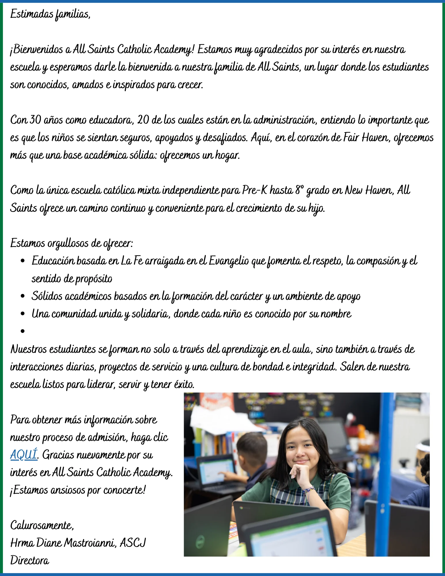 student smiling while working on laptop