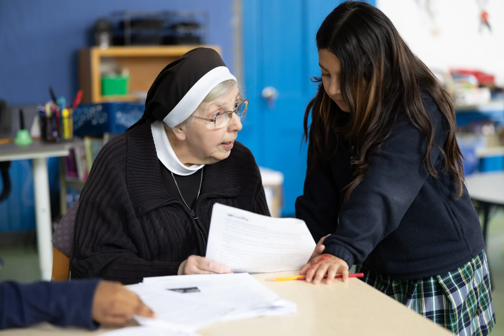 tutor working with a student on an assignment