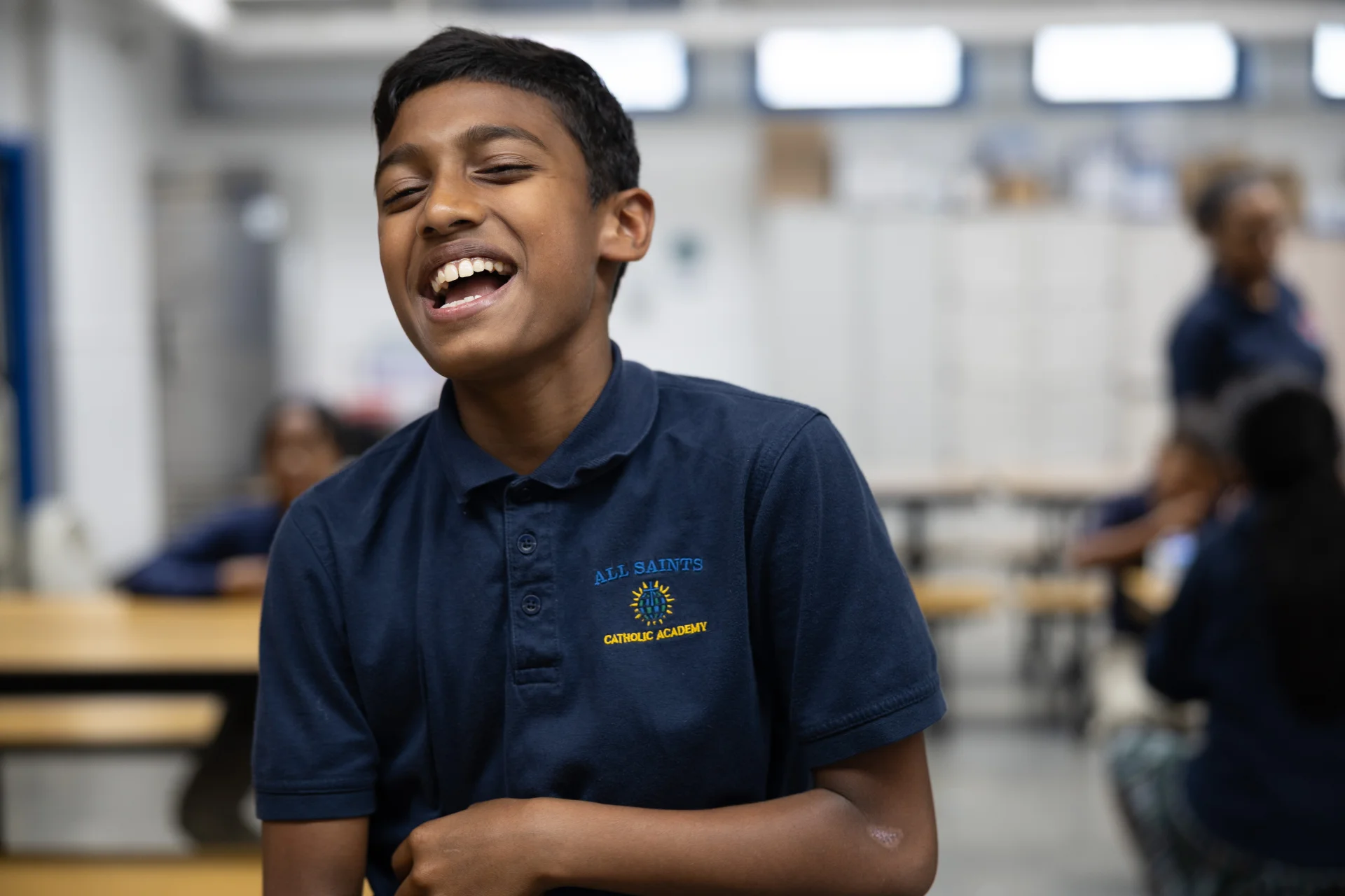 student laughing in the cafeteria