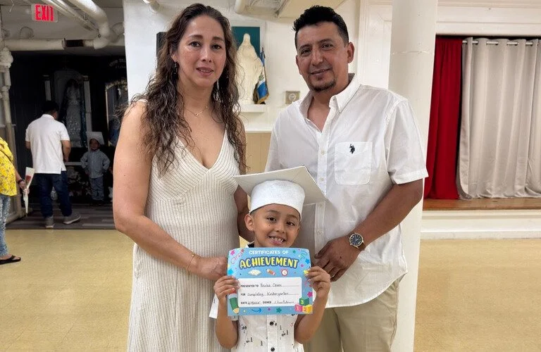 parents and child at Kindergarten graduation