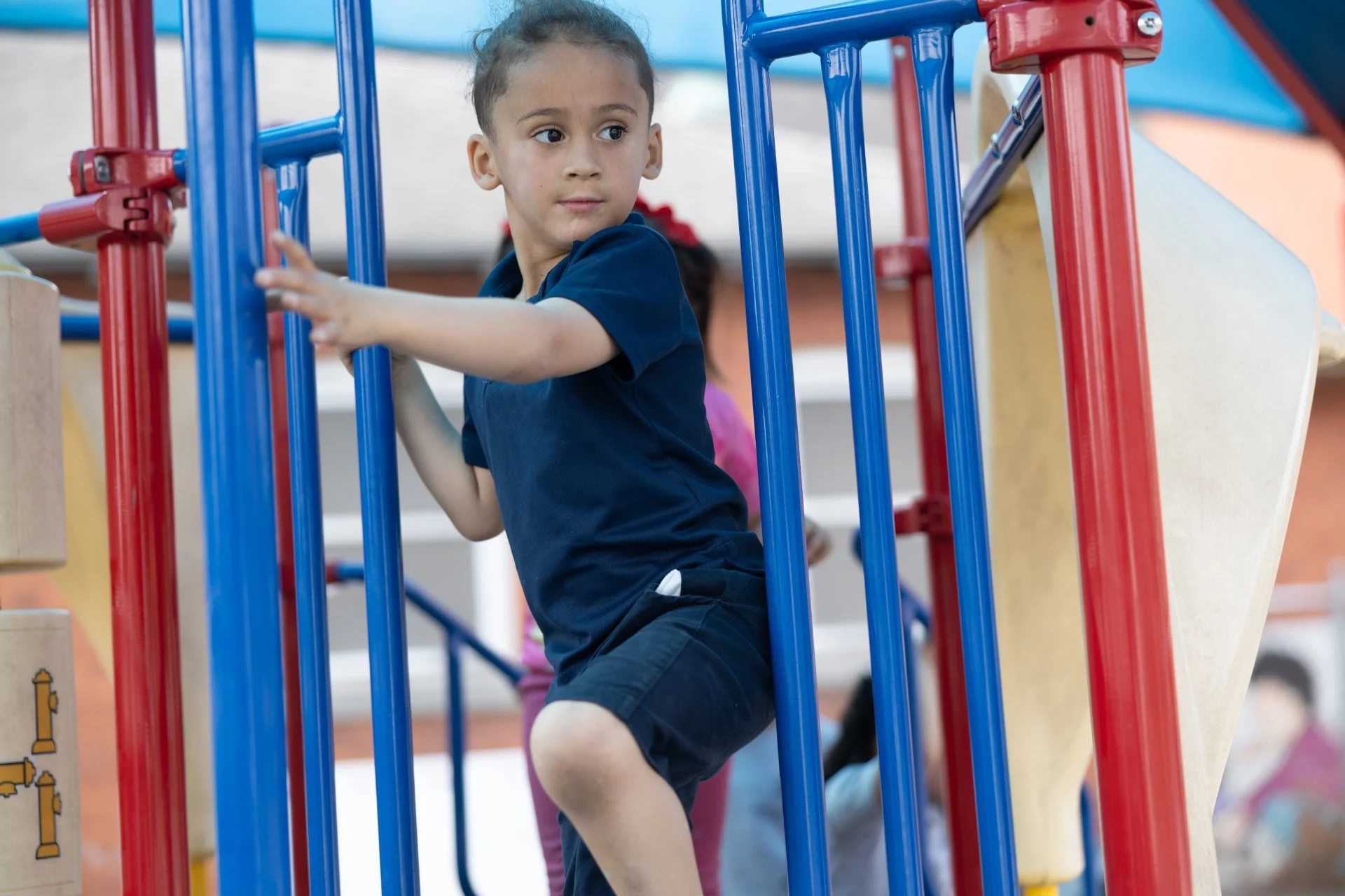 student playing on playground set