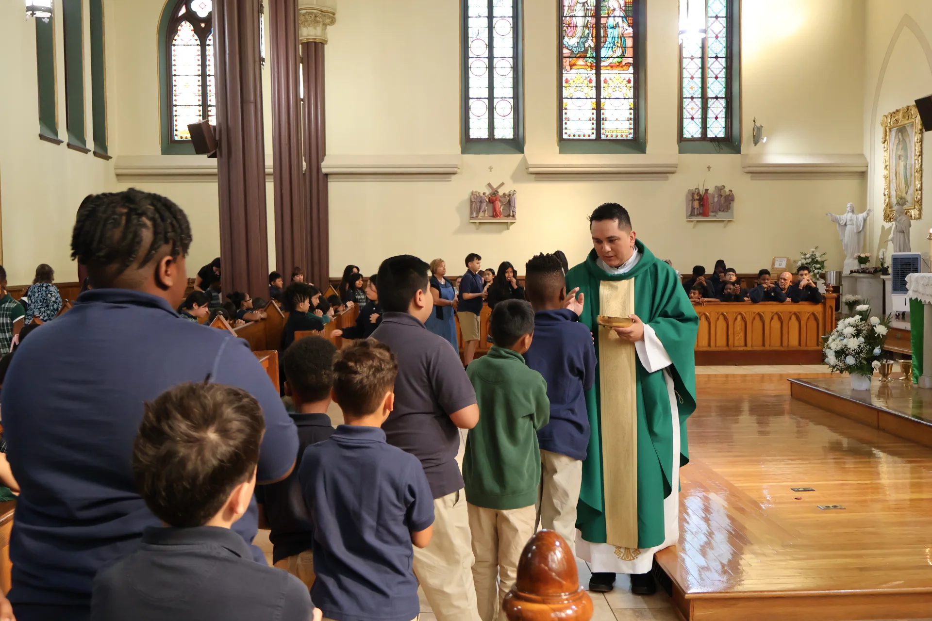 priest passing out communion